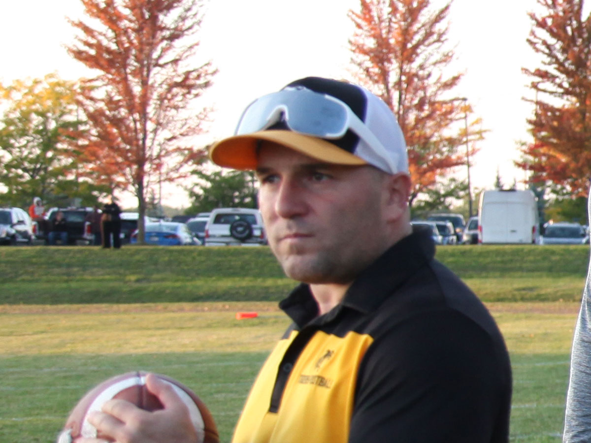 Ely Matlow coaching Uxbridge Tigers players on the field