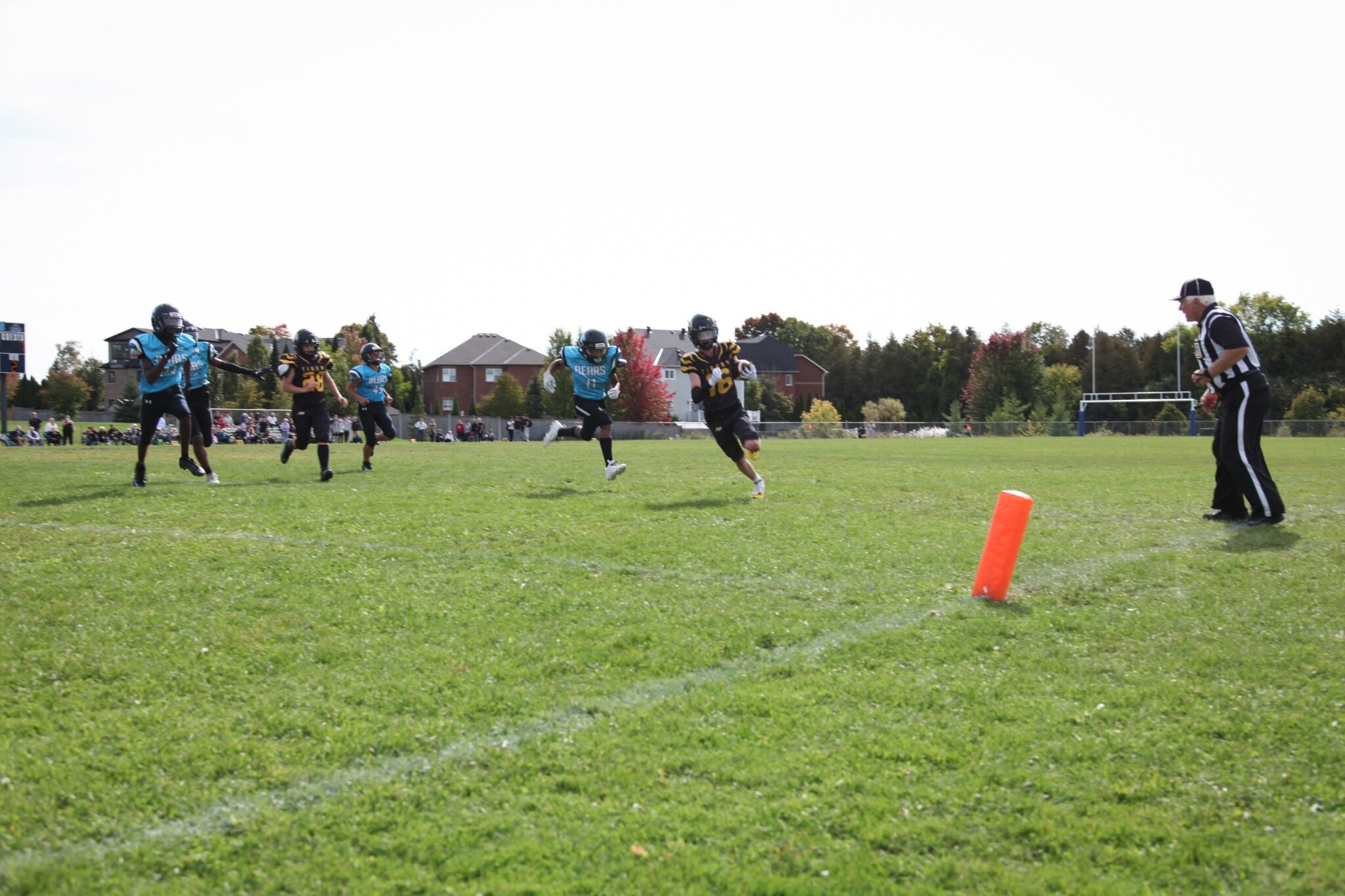 A Tigers runner breaks toward the end zone