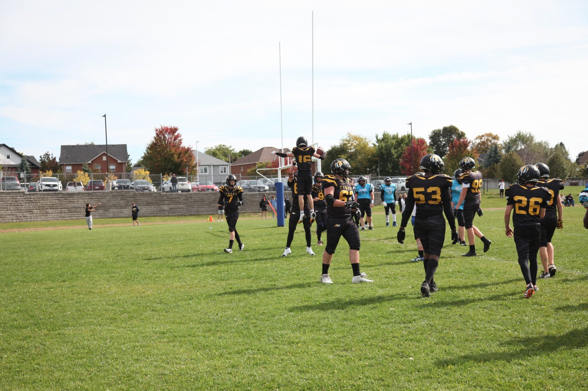 Tigers players celebrate after a scoring play