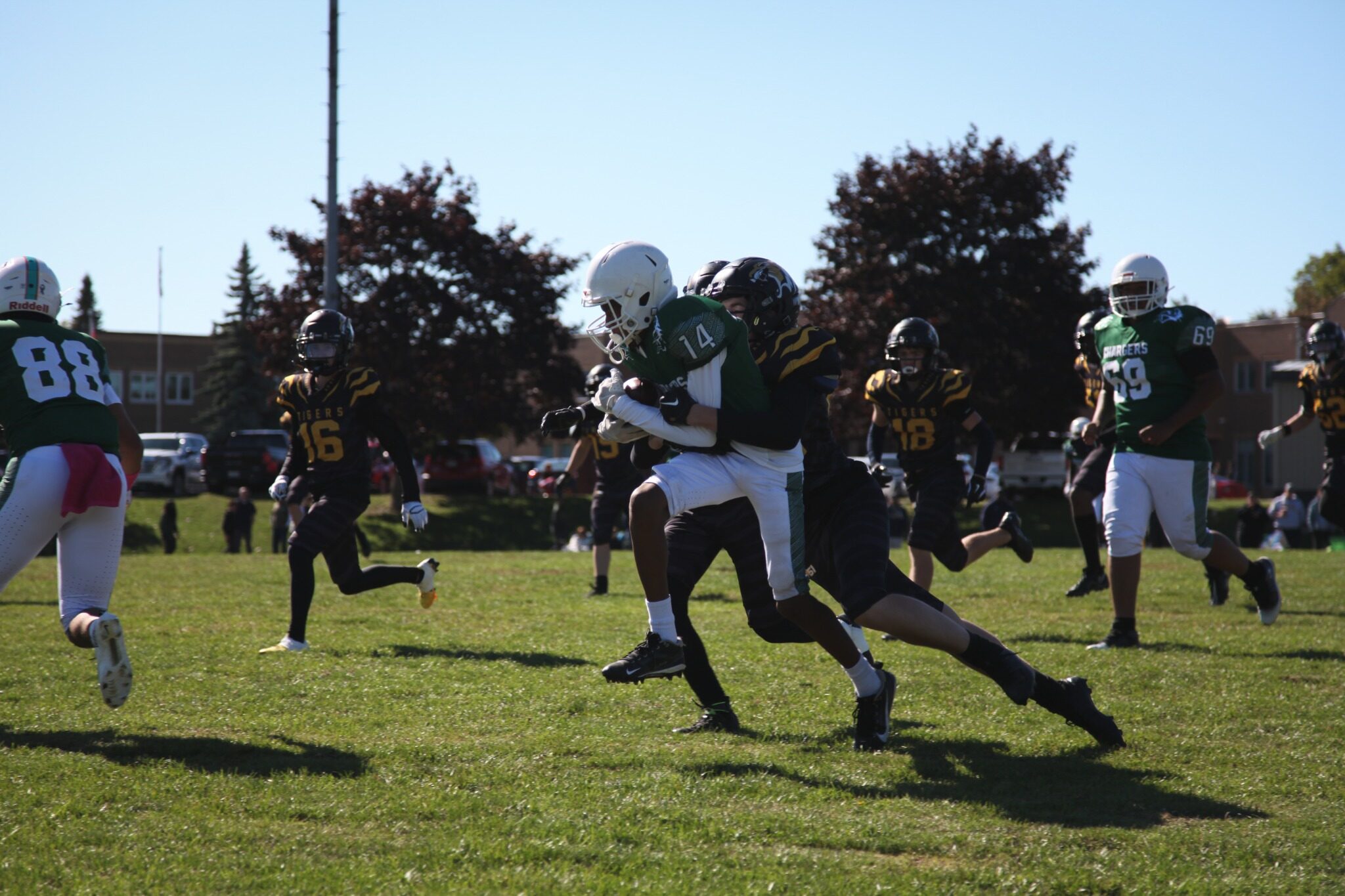 A Tigers runner carries the ball against Dennis O’Connor