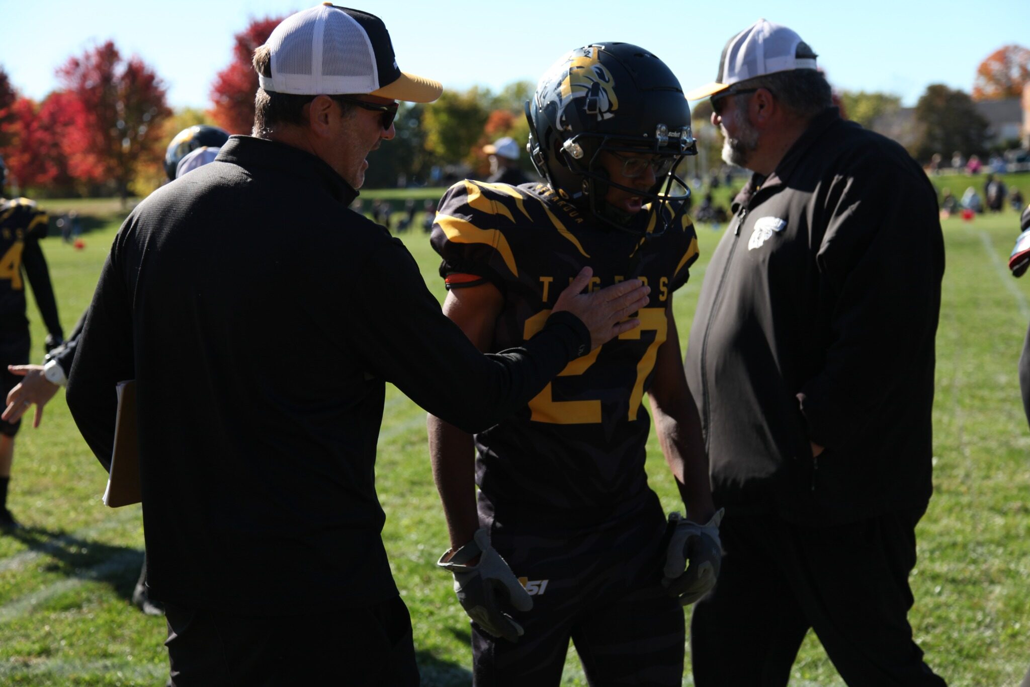 Coaches meet with a Tigers player