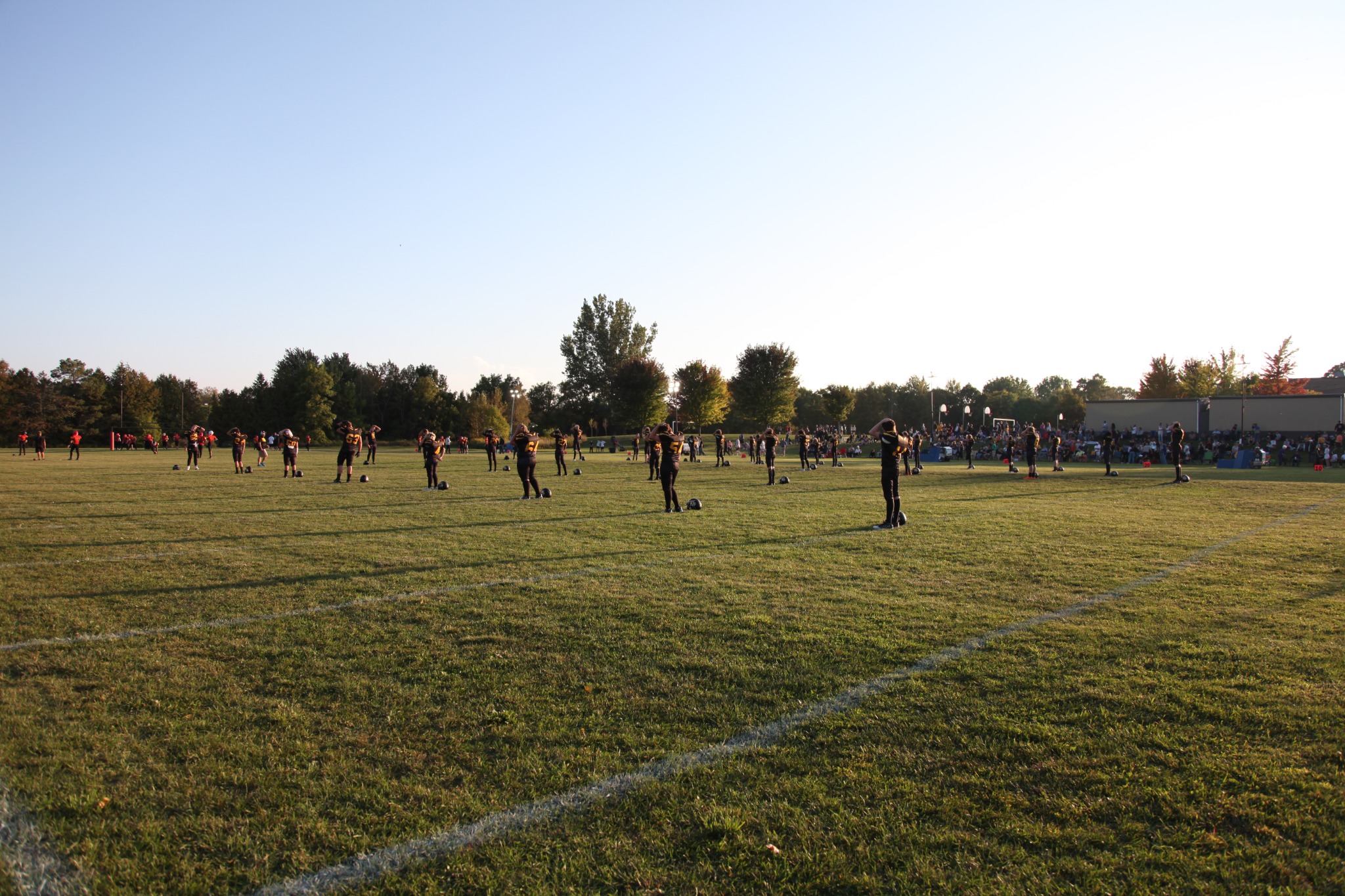 The Tigers warm up across the field before kickoff