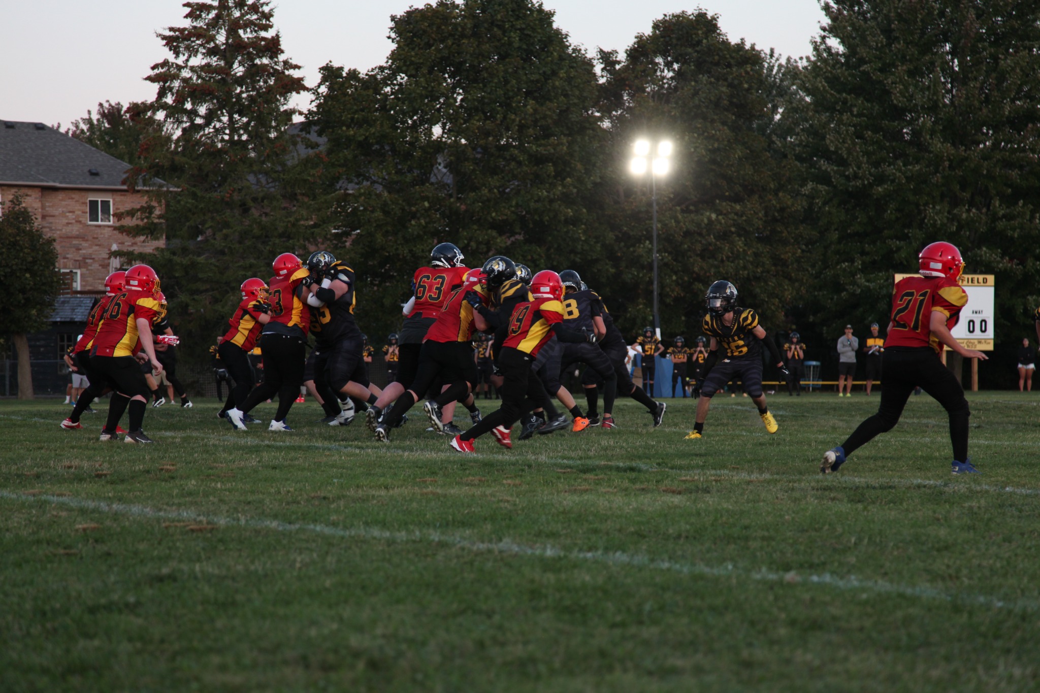 The Tigers run a play under the Homecoming lights