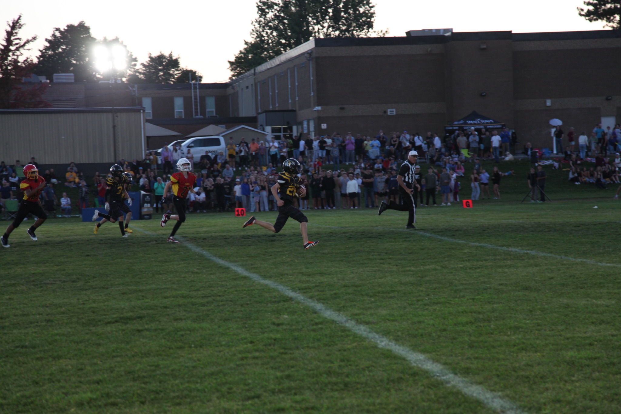 A Tigers runner races down the sideline