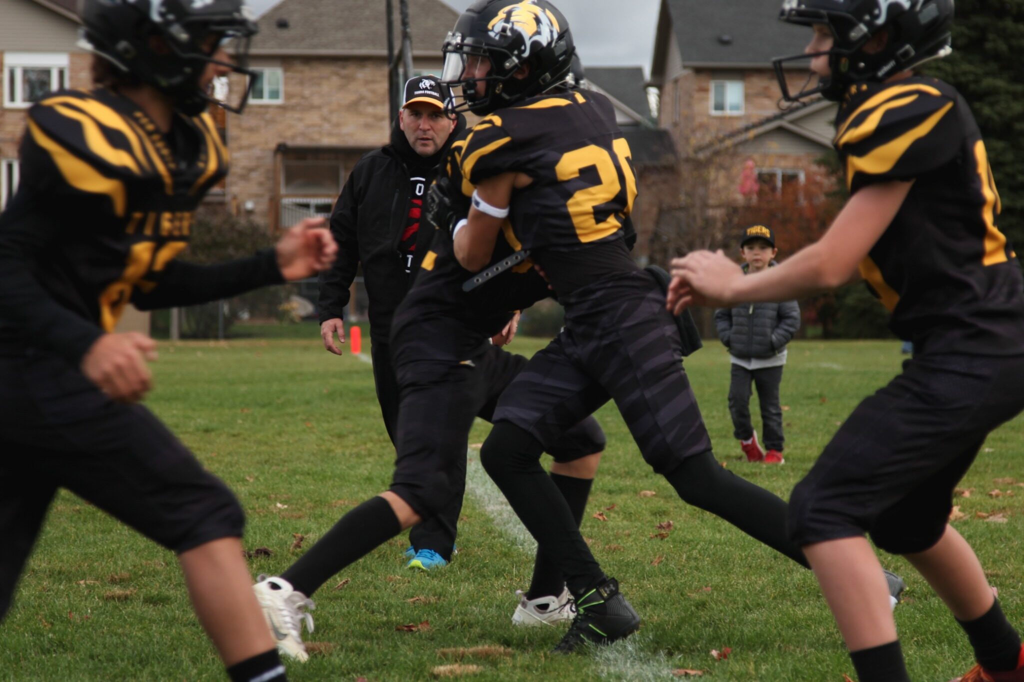 A Tigers runner takes a handoff in the playoff opener